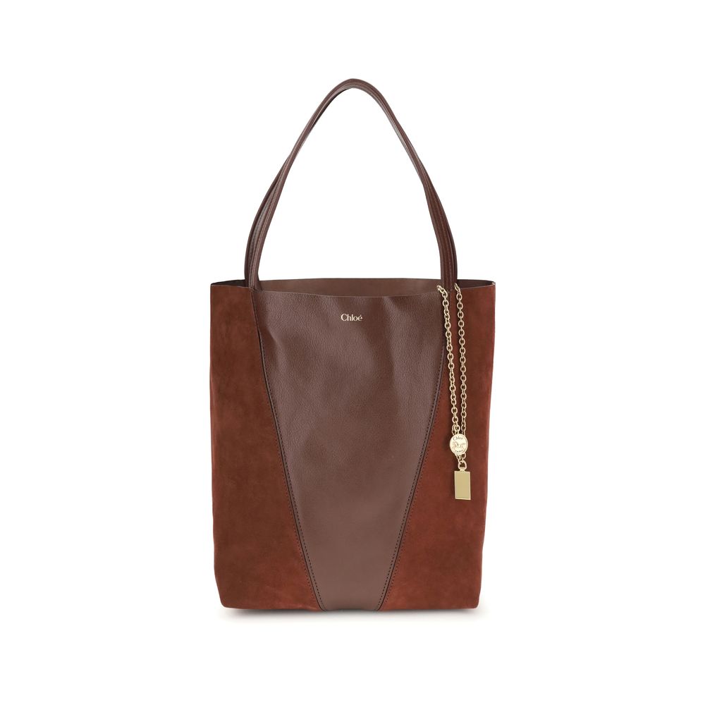 Brown leather tote bag with gold chain detail on a white background
