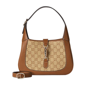 Brown handbag with beige pattern on a light gray background