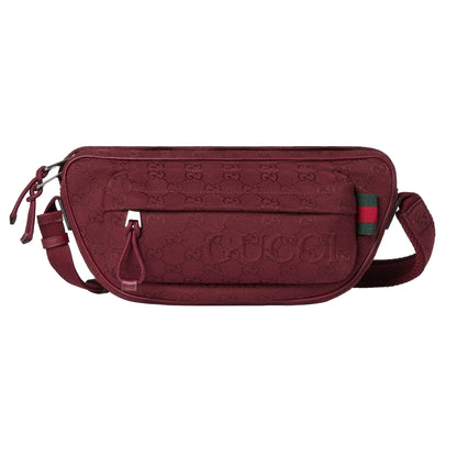 Maroon Gucci bag with logo on a light gray background