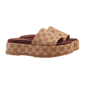 Beige and brown patterned slide sandals on a light gray background