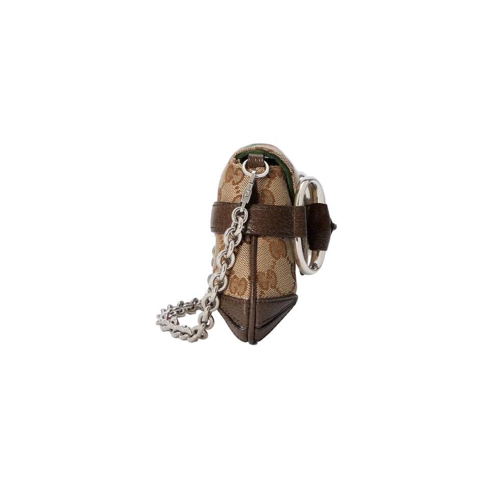 Designer keychain with patterned fabric and metal chain on a light gray background