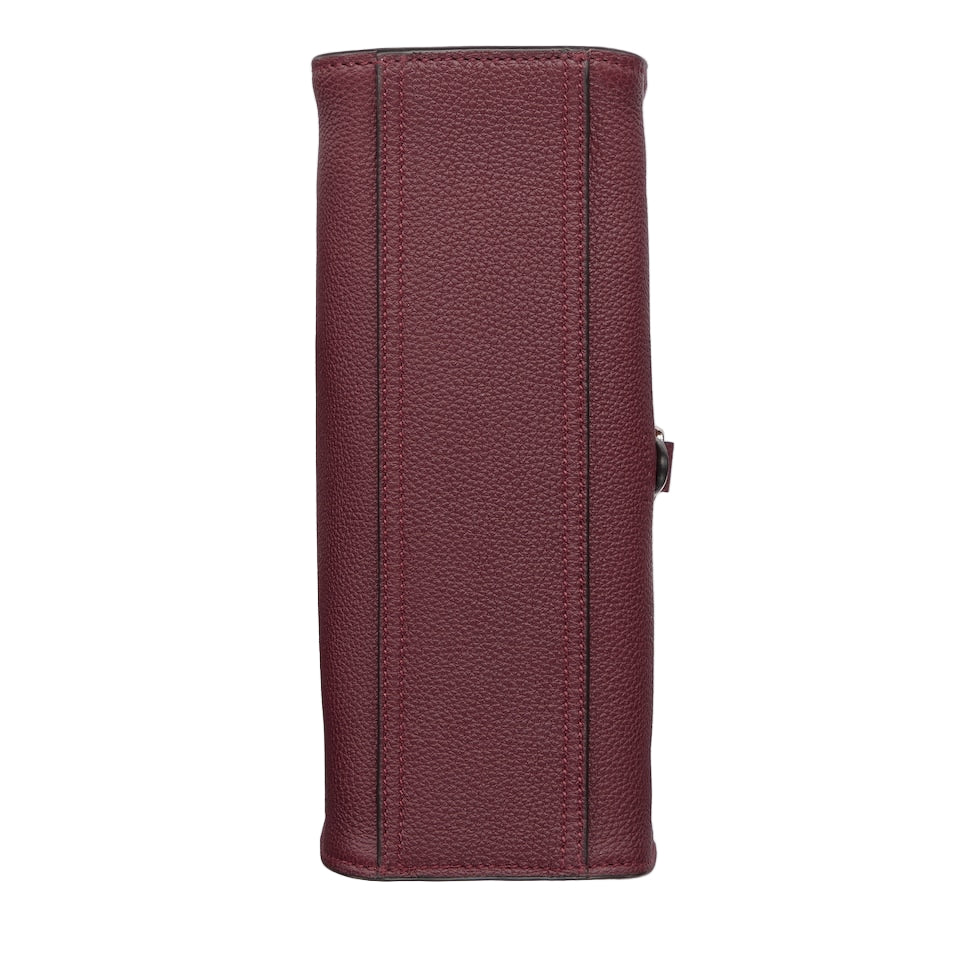 Maroon leather wallet on a light gray background