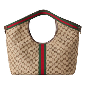 Beige Gucci bag with red and green stripes on a light gray background