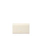 Beige clutch bag on a light beige background