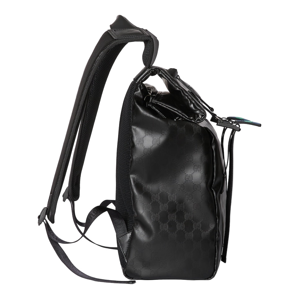 Black backpack with a pattern on a light gray background