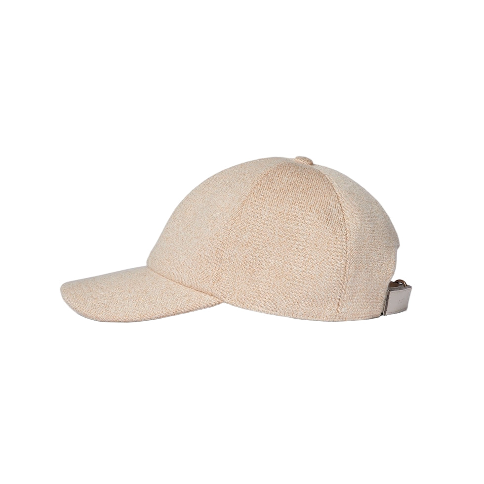 Beige baseball cap on a light gray background