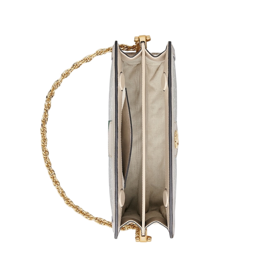 Gold chain clutch bag on a light gray background
