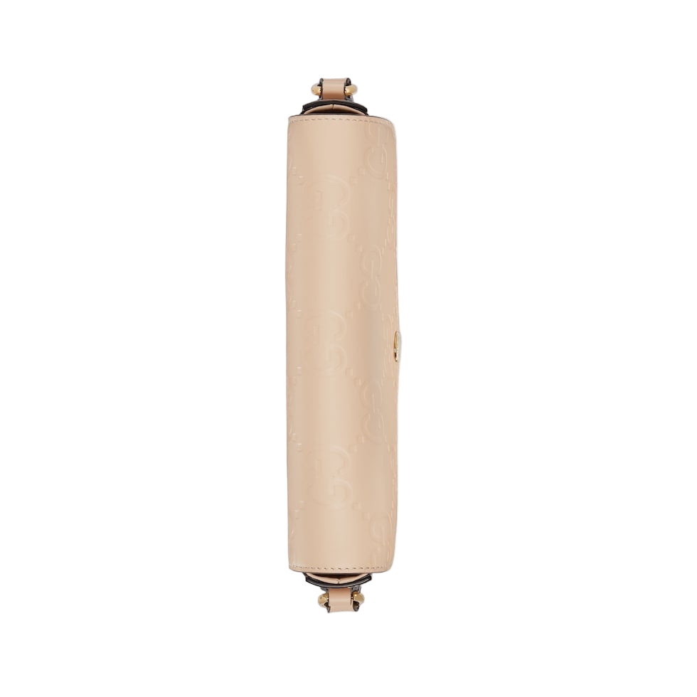 Beige cylindrical product on a light gray background