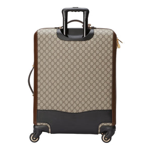 Patterned suitcase with black accents on a light gray background