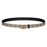 Designer belt with brand logo on a light gray background