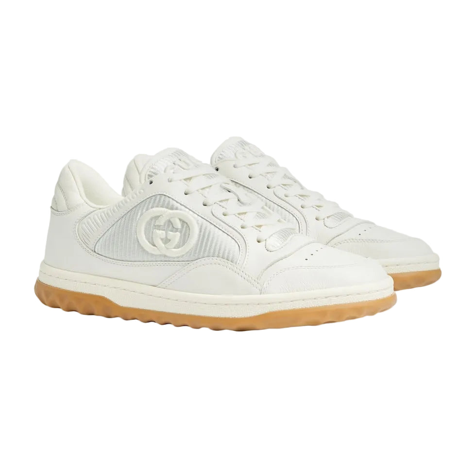 White sneakers with a brand logo on a light gray background
