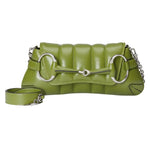 Green quilted Gucci Horsebit handbag with silver hardware on a light gray background
