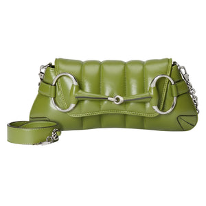 Green quilted Gucci Horsebit handbag with silver hardware on a light gray background