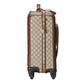 Patterned suitcase with brown accents on a light gray background