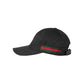 Black cap with a red and green stripe on a light gray background