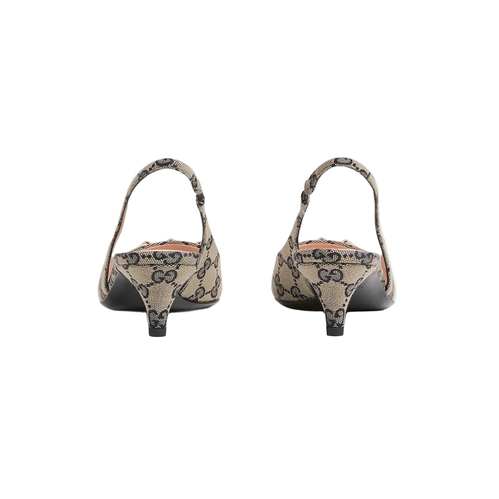 Pair of high-heeled shoes with decorative pattern on a light gray background