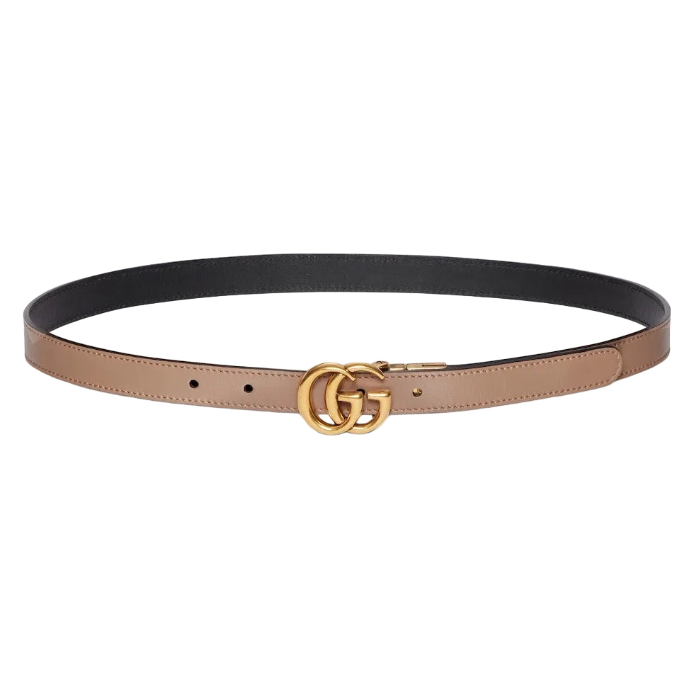 Two-toned belt with gold Gucci logo buckle on a light gray background