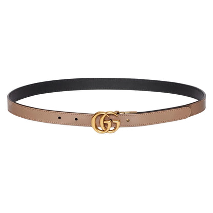 Two-toned belt with gold Gucci logo buckle on a light gray background