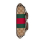 Gucci keychain with monogram and striped design on a light gray background