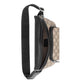 Beige and black patterned bag with a black strap on a light gray background