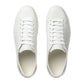 Pair of white sneakers on a light gray background