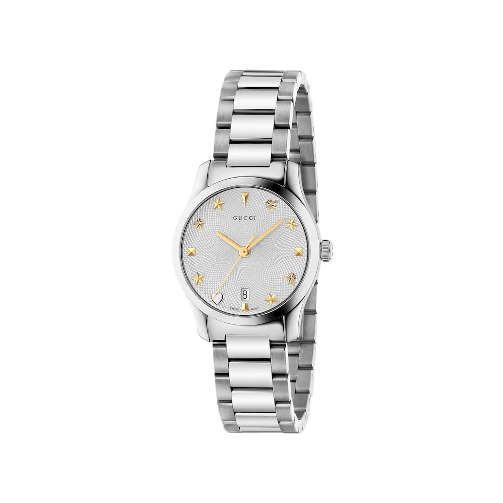 Silver Gucci watch with star design on a light gray background