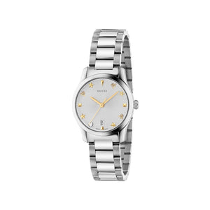 Silver Gucci watch with star design on a light gray background