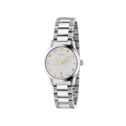 Silver Gucci watch with star design on a light gray background