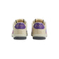Beige Gucci sneakers with purple accents on a light gray background