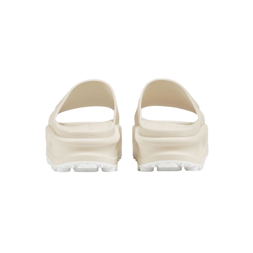 Pair of beige sandals on a white background