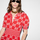 Person wearing a red outfit with a pattern, sunglasses, and a necklace on a white background