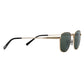 Gold-framed sunglasses with black arms on a light gray background
