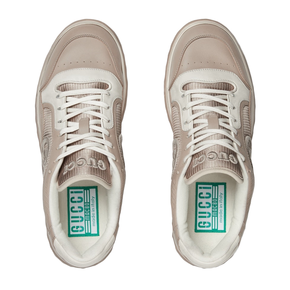 Pair of Gucci sneakers on a light gray background
