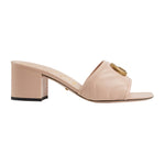 Beige gucci sandal with block heel on a light gray background