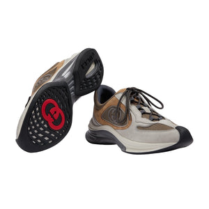 Sneakers with a unique sole design on a light gray background