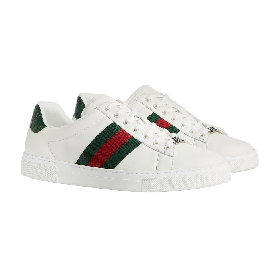 White sneakers with green and red stripes on a white background