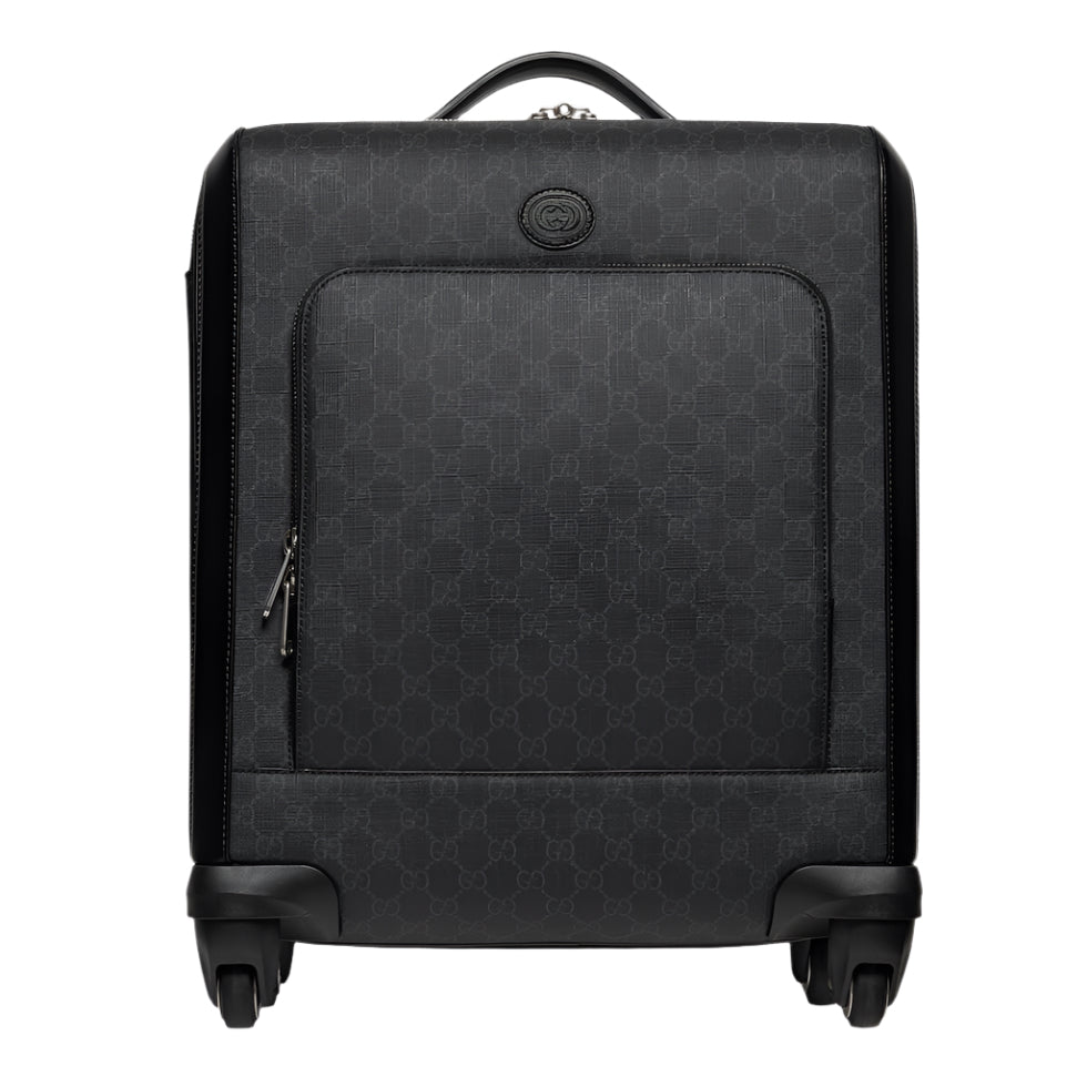 Black Gucci suitcase with a geometric pattern on a white background
