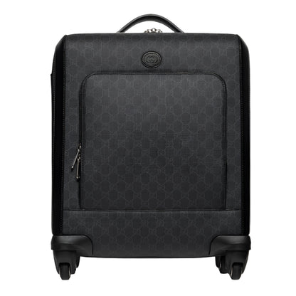Black Gucci suitcase with a geometric pattern on a white background
