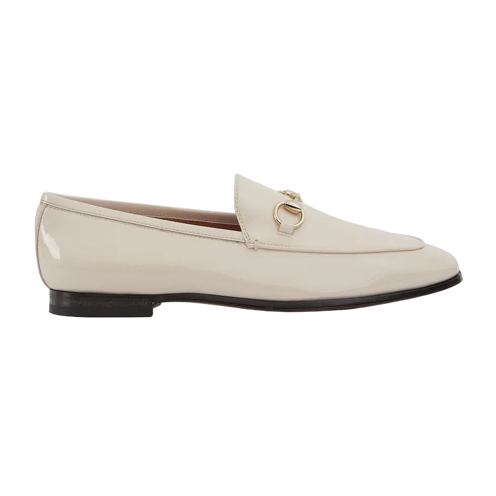 Beige loafer shoe on a light gray background