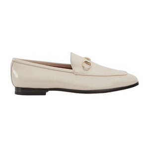 Beige loafer shoe on a light gray background