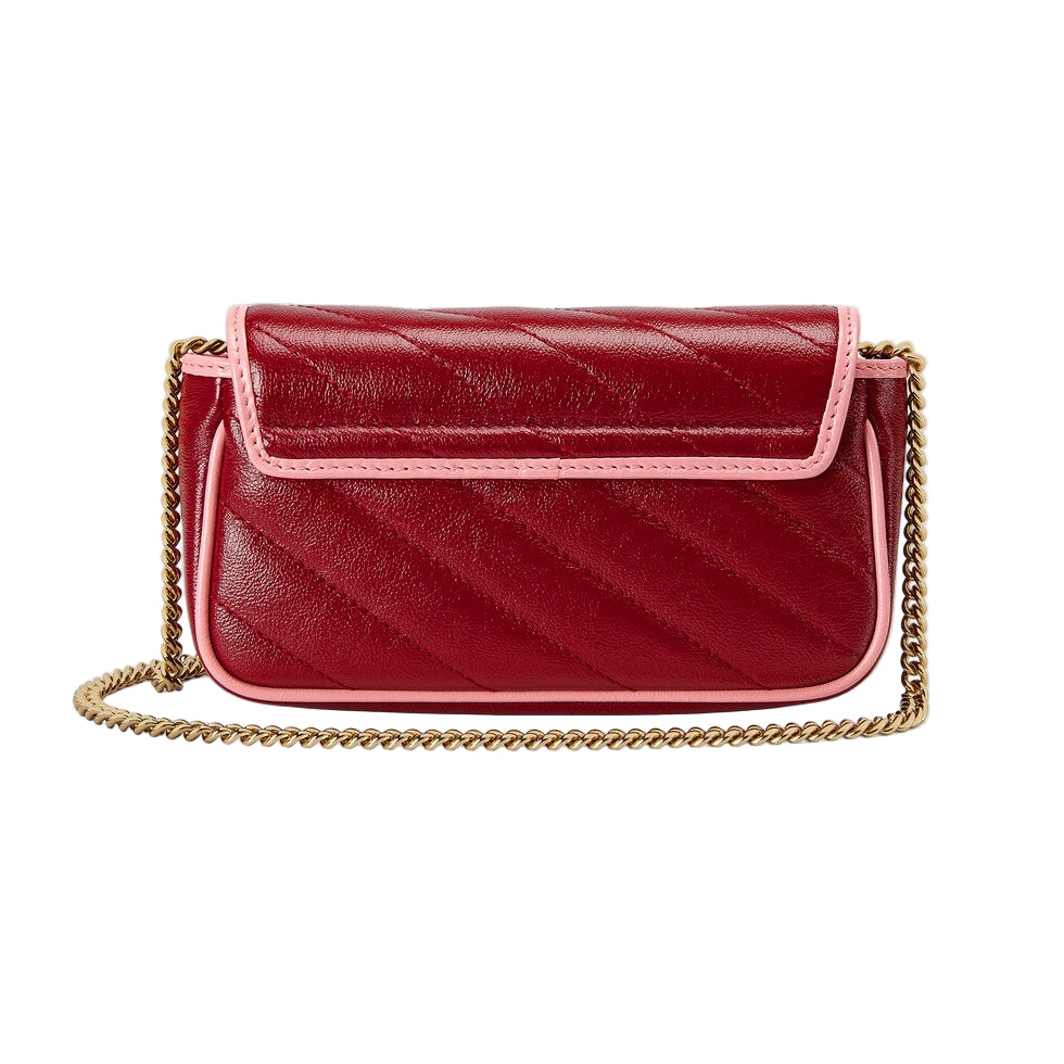 Red quilted handbag with a gold chain on a light gray background