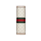 Gucci travel case with monogram pattern and red and green stripe on a light gray background