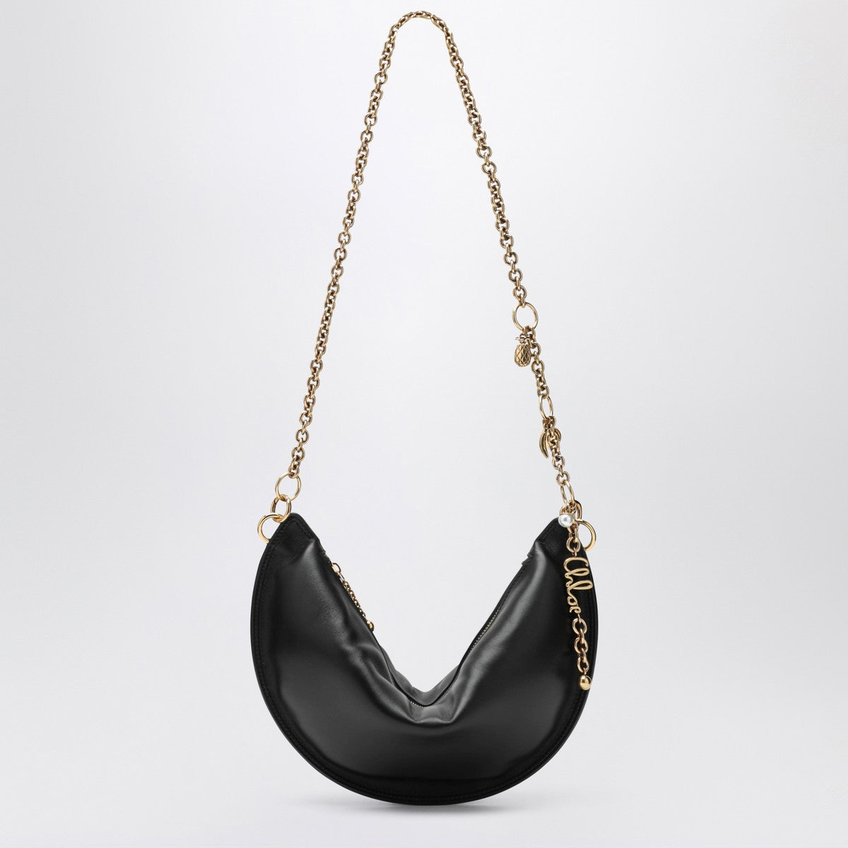 Black Chloe with gold chain on a white background