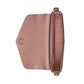 Pink handbag with a visible brand logo on a light gray background