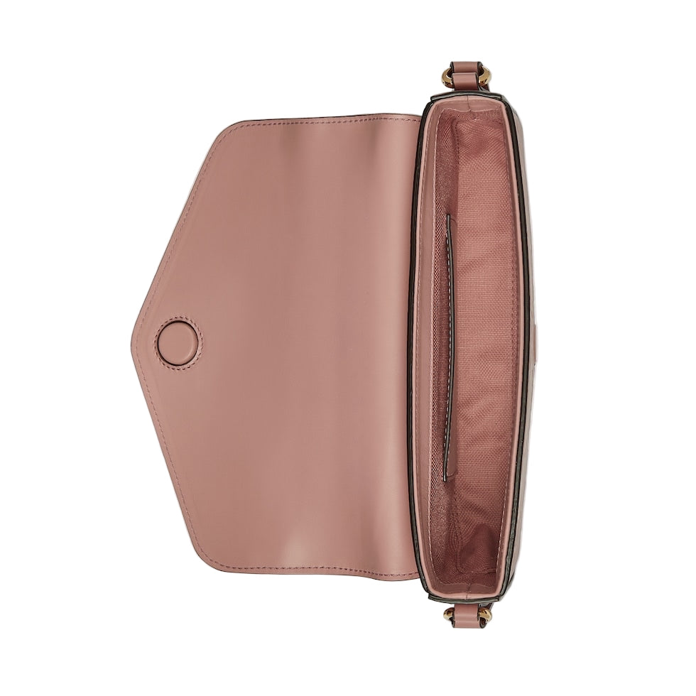 Pink handbag with a visible brand logo on a light gray background