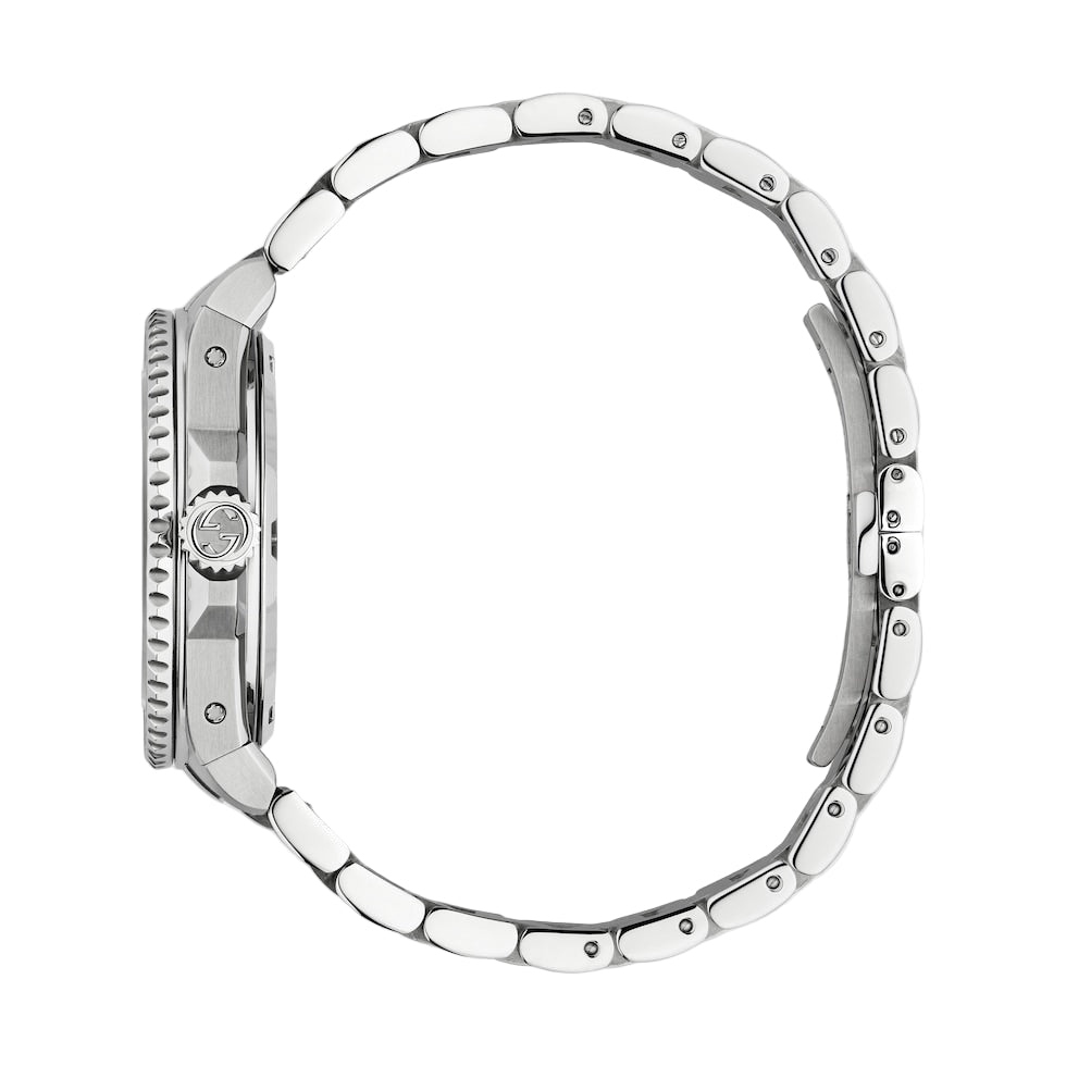 Silver watch with a detailed bezel on a light gray background