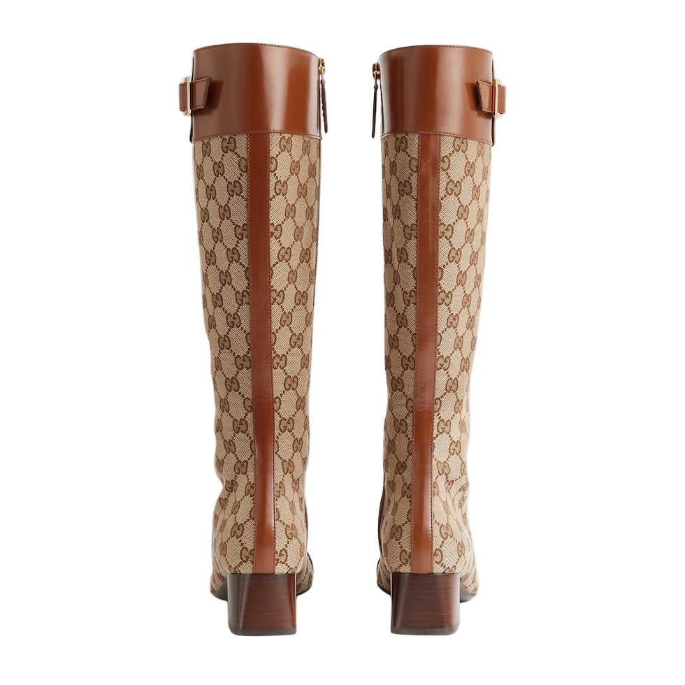 Pair of Gucci knee-high boots with brown and beige pattern on a white background