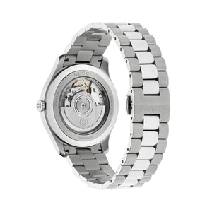 Silver Gucci watch with open face on a light gray background