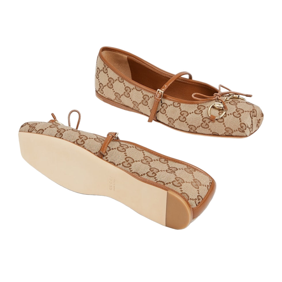 Beige and brown patterned flat shoe with matching shoebox on a light gray background