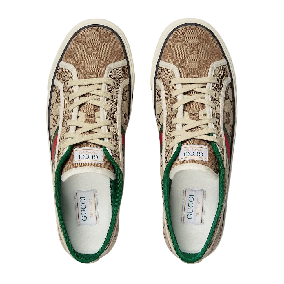 Pair of Gucci sneakers with patterned design on a white background